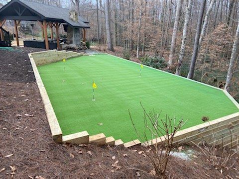 Putting green installation in Marietta GA by Morning Dew Landscapes.